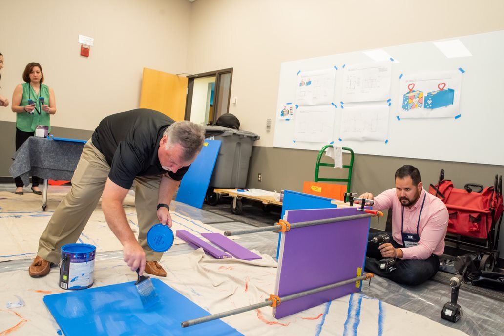 COAA Cares Happy Wheels Cart being built featuring Bobby Brown